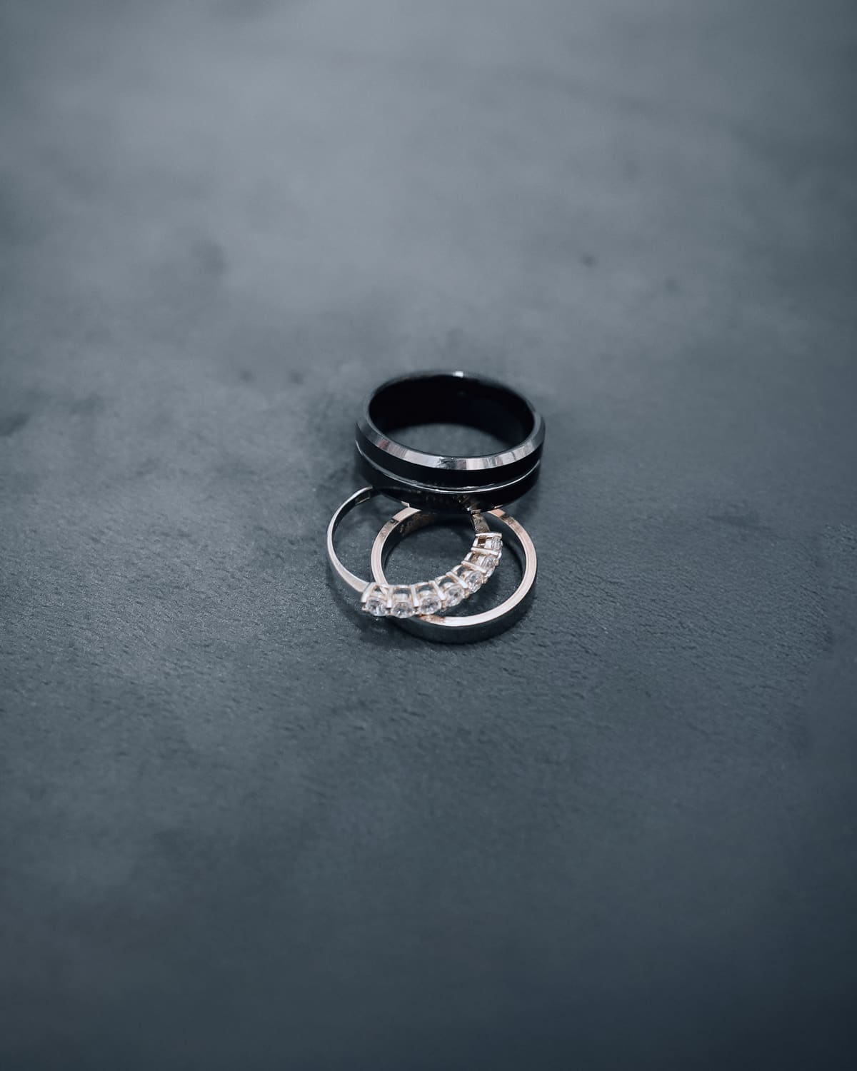 Wedding ring beside a hotel key card and car keys