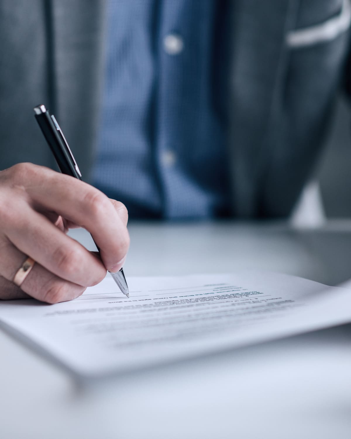 Contract and fountain pen on a boardroom table