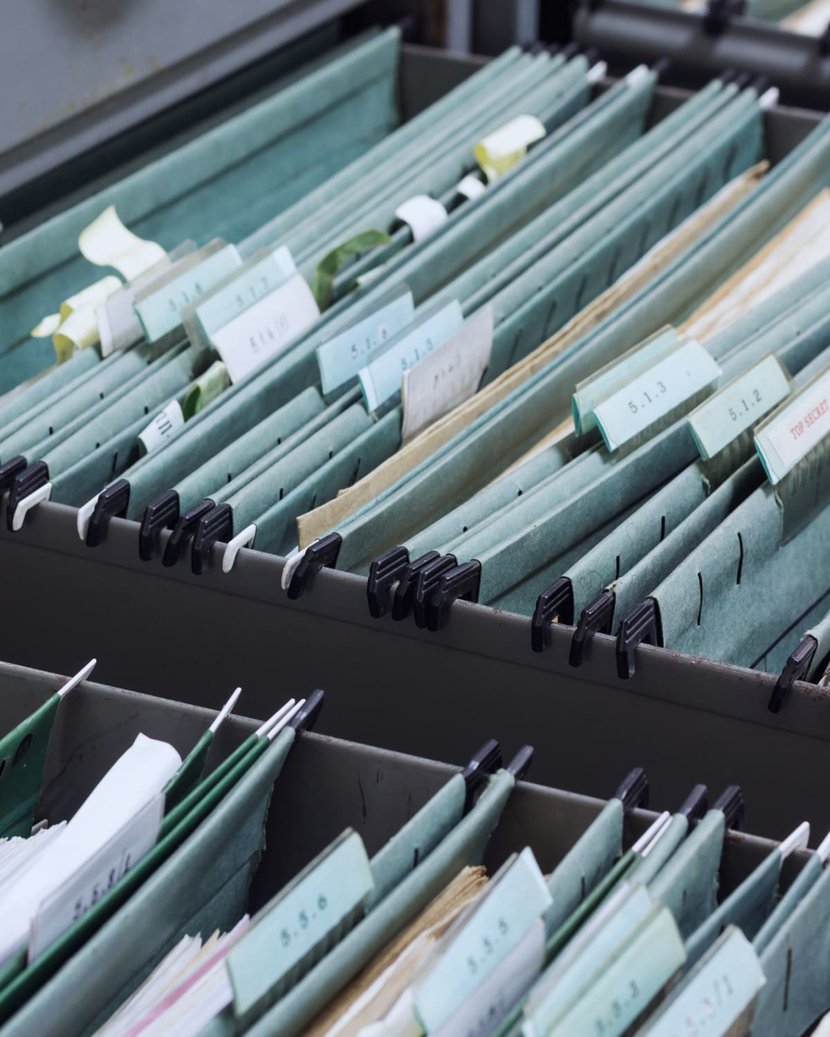 Open file drawer and legal pad in a school administration office