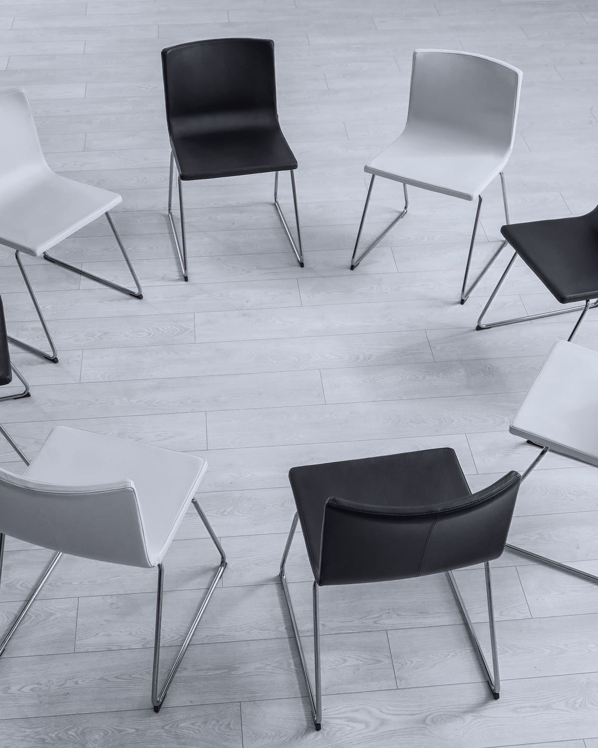 Folding chairs arranged in a circle in a quiet debriefing room
